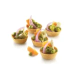 Five round savoury vegetable tartlets made using the Silikomart Airplus 15 mould