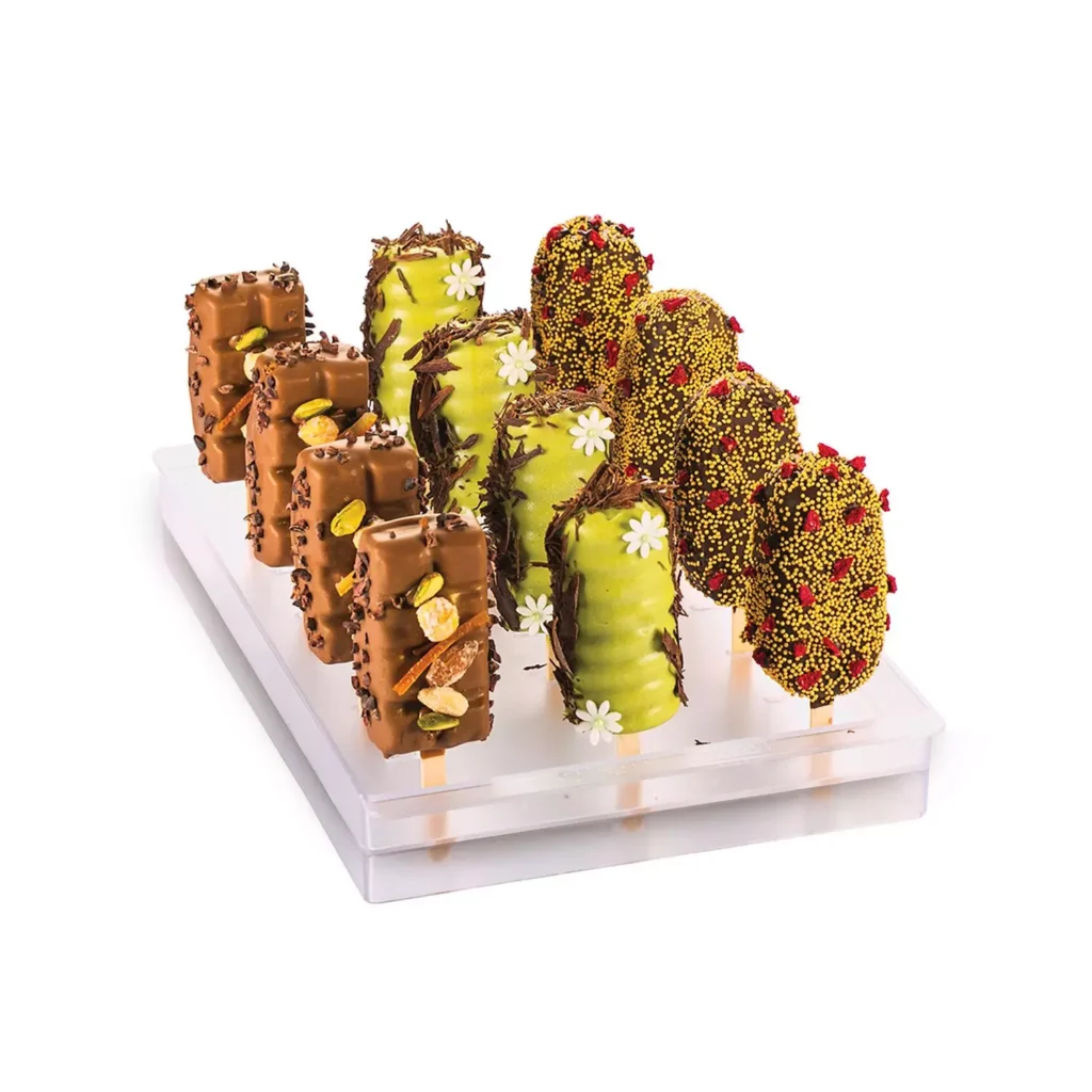 Decorated chocolate and pistachio ice cream bars displayed on the Silikomart Espogel Up stand