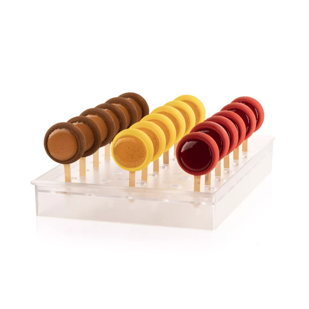 Colourful mini desserts on sticks displayed upright in the Silikomart Espogel Up Mini stand