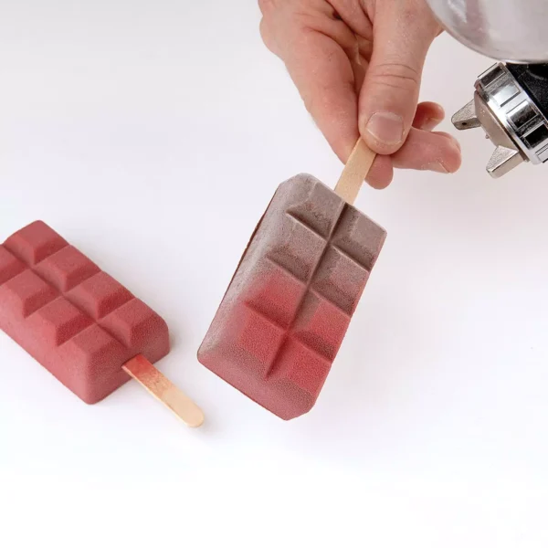 Chocolate-shaped frozen gelato bars presented on natural wooden ice cream sticks