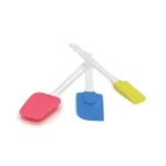 Blue Silikomart large silicone spatula displayed with pink and yellow spatulas