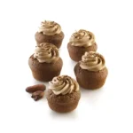 Five round chocolate mini cakes with piped cream made using the Silikomart Air Plus 18 mould