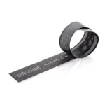 Flexible black Silikomart Airplus microperforated pastry strip formed into a circular band