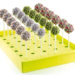 Fluo Green Silikomart Espogel Up Mini stand displaying decorated desserts on sticks