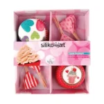 Silikomart box containing heart-patterned paper baking cases and matching cupcake topper picks