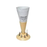 Cream Silikomart pastry bag stand holding one white piping bag with eight metal nozzle spaces