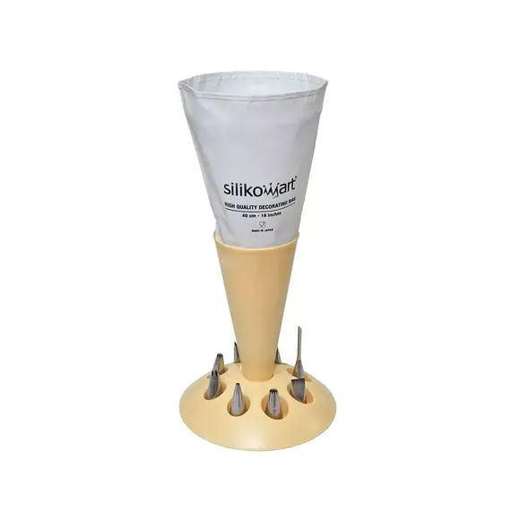 Cream Silikomart pastry bag stand holding one white piping bag with eight metal nozzle spaces