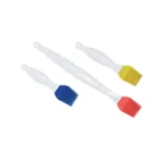Yellow Silikomart medium silicone pastry brush displayed with blue and red brushes